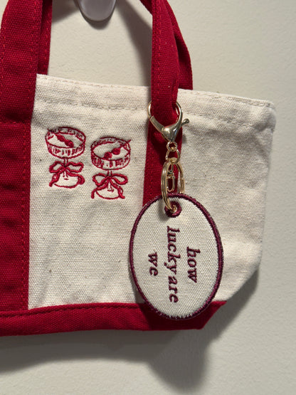 How Lucky Are We Charm  - Custom Embroidered Keychain Tag